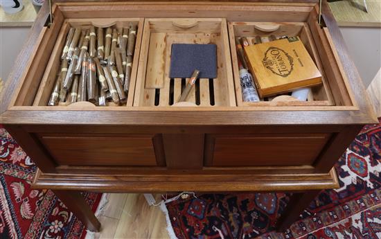 A bespoke large walnut table cigar humidor fitted numerous trays and a collection of cigars